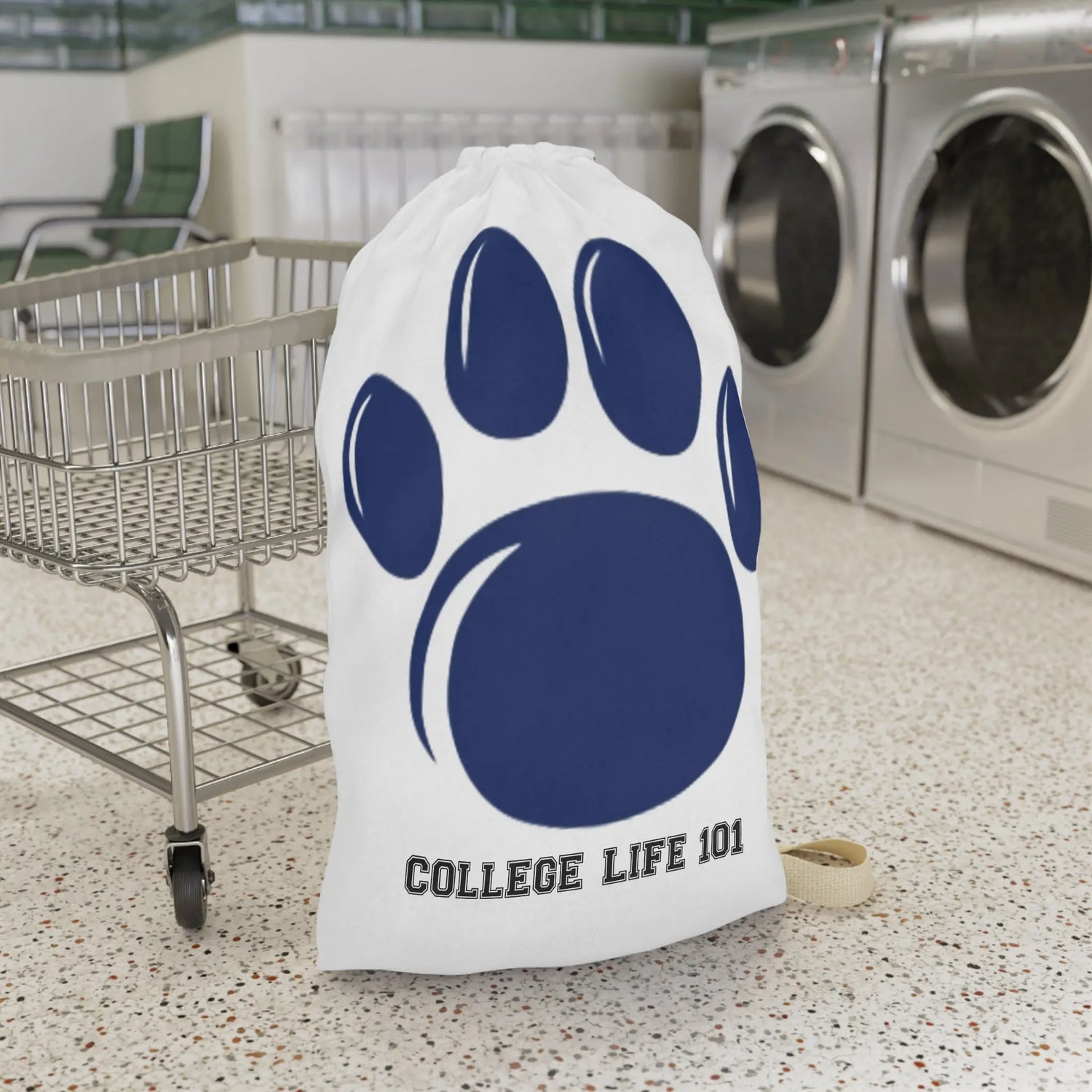 Smiling young man loading white laundry into washing machine in a cozy modern kitchen