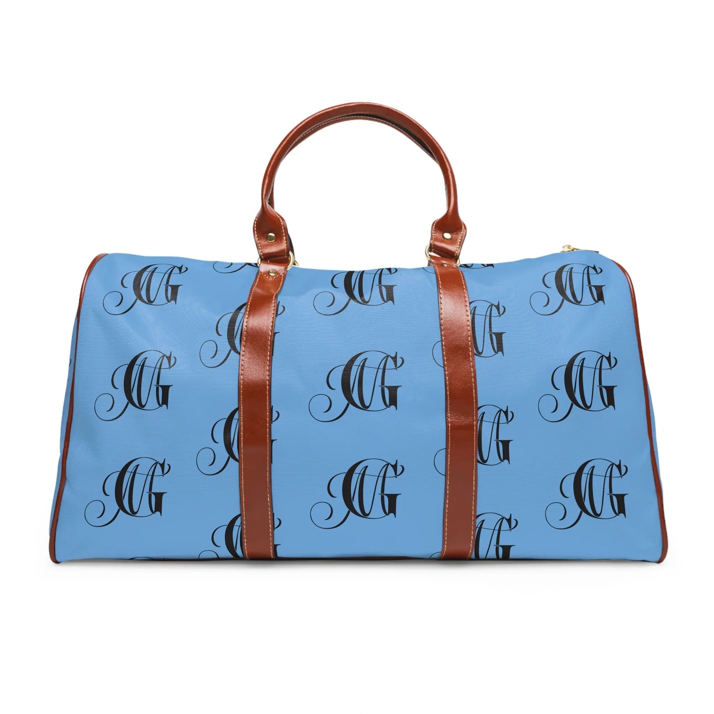 Blue travel duffel bag with brown leather handles and black monogram pattern on white background